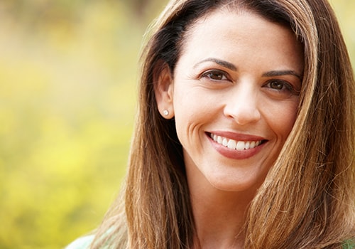 A smiling woman who is a patient at our Grass Valley dentist